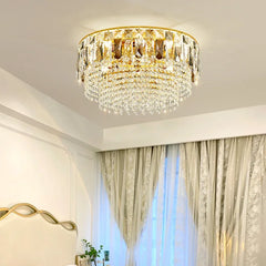 View of the gold crystal chandelier from a different angle in a well-lit room.
