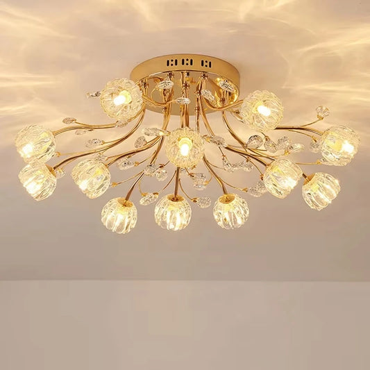 Gold semi-flush mount ceiling light with floral design and clear crystal accents, lit up