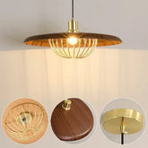 Close-up of a wood-finish pendant light with a gold wire cage surrounding the bulb.