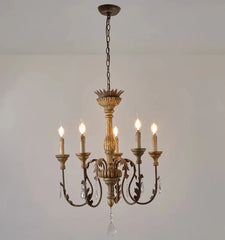 Decorative chandelier with six lights on a plain background