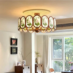 Bronze Chandelier with Frosted Glass and Green Leaf Floral Accents