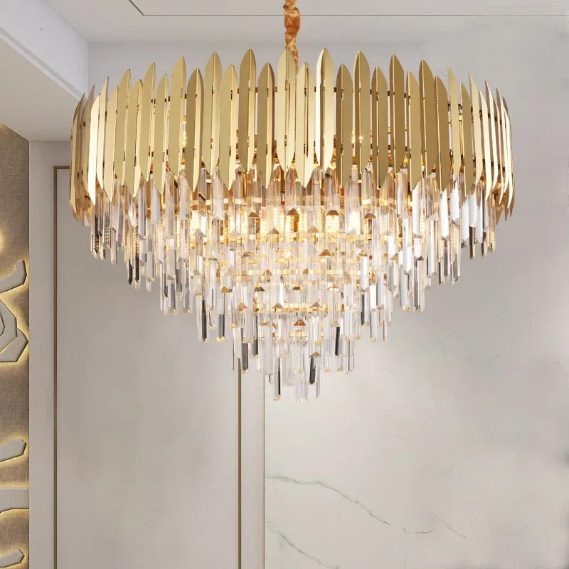 Close-up of a gold and crystal tiered cascading chandelier with many crystal prisms.
