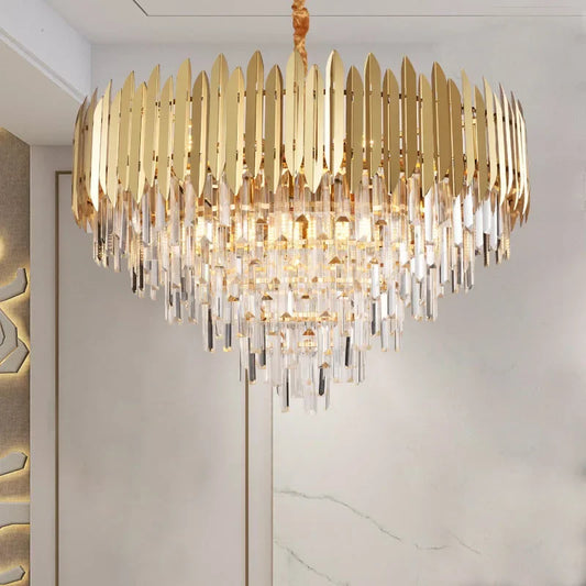 Close-up of a gold and crystal tiered cascading chandelier with many crystal prisms.
