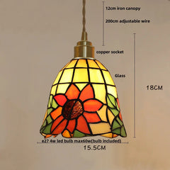Stained glass pendant light with measurements on a beige background