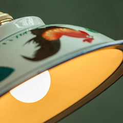 Close-up of a vintage camera with a colorful design on a dark background