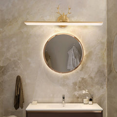Bathroom setup with round mirror, light fixture, and sink.