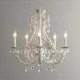 Decorative chandelier with crystal accents on a plain background