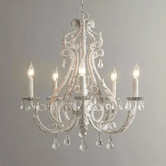 Decorative chandelier with crystal accents on a plain background