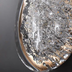 Close-up of a textured silver object with a reflective surface