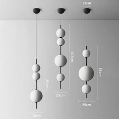 Modern pendant light with spherical design and measurements on a gray background