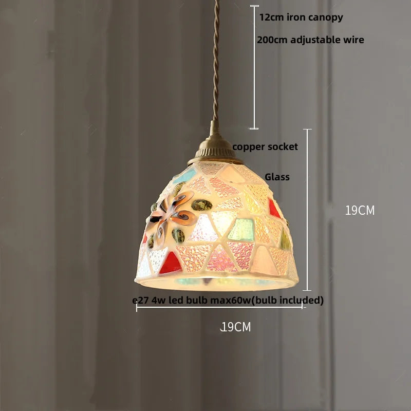 Pendant light with colorful glass shade and measurements on a gray background