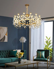 Luxurious chandelier in a living room with green sofa and decorative elements.