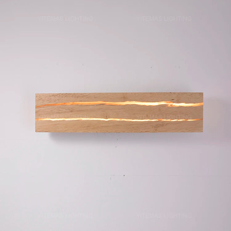 Wooden light fixture with a warm glow on a gray background