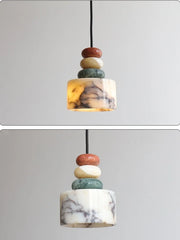 Marble-patterned pendant light with stacked cylindrical stones on a gray background