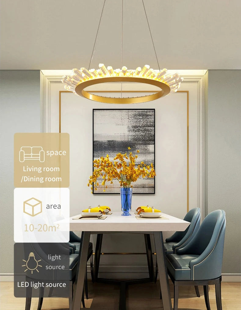 Modern dining room with a chandelier, table, chairs, and decor elements.