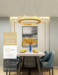Modern dining room with a chandelier, table, chairs, and decor elements.