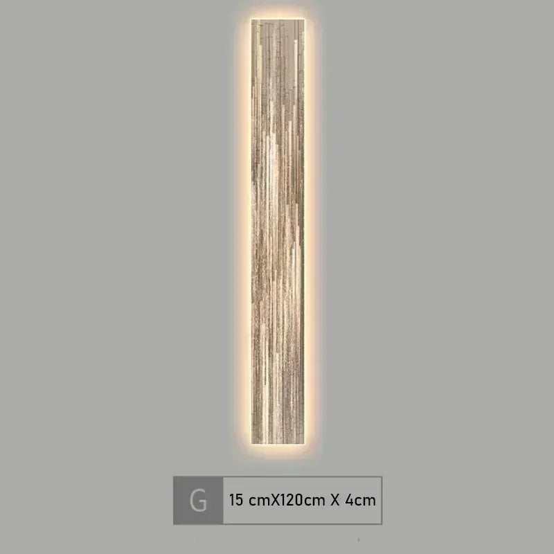 Wall-mounted light fixture with a textured design on a gray background