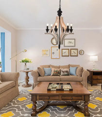 Living room with beige sofa, wooden coffee table, and decorative elements.