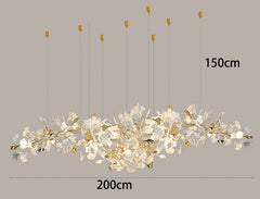 Long decorative chandelier with branch-like design on a gray background