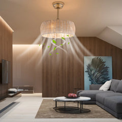 Modern living room with a chandelier, gray sofa, and decorative elements.