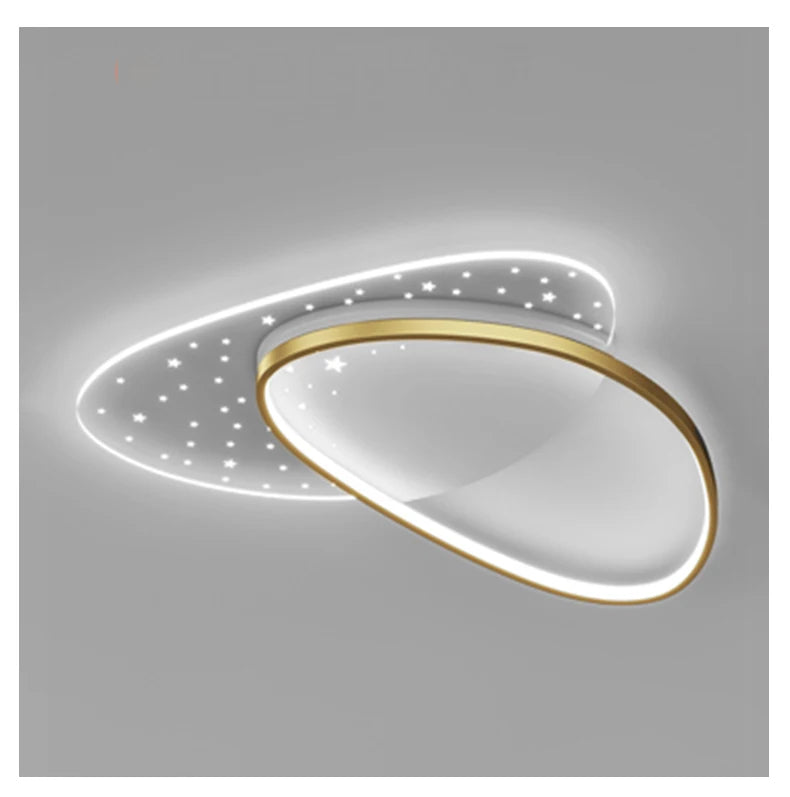 Modern ceiling light fixture with gold trim on a gray background