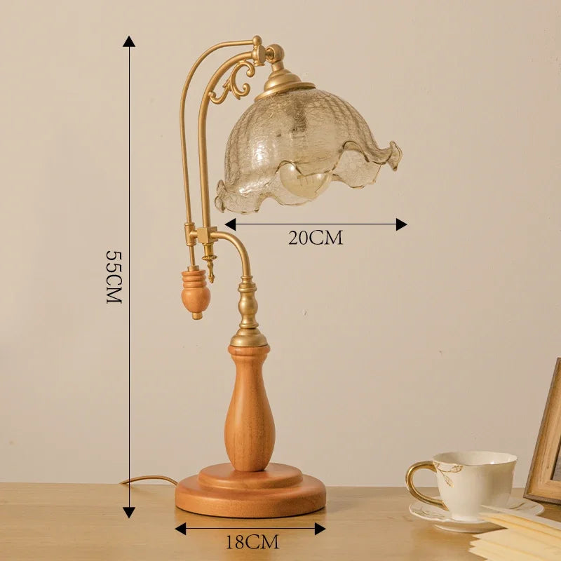 Table lamp with wooden base and glass shade, shown with measurements on a beige background.