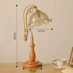 Table lamp with wooden base and glass shade, shown with measurements on a beige background.