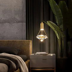 Modern bedroom with a decorative pendant light, nightstand, and plant.