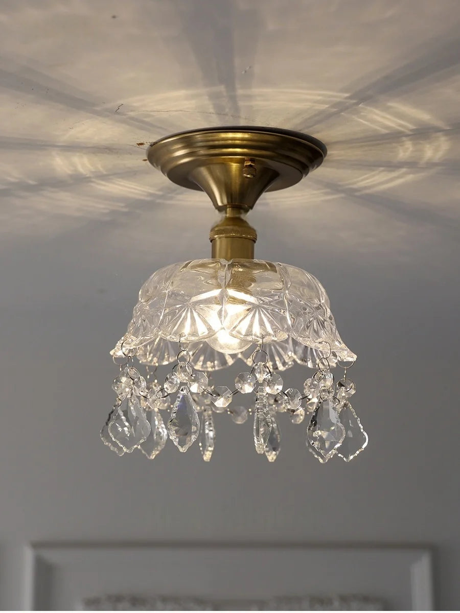Small chandelier with crystal accents on a ceiling