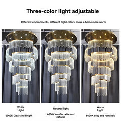 Chandelier with three different light color settings on a gray curtain background.