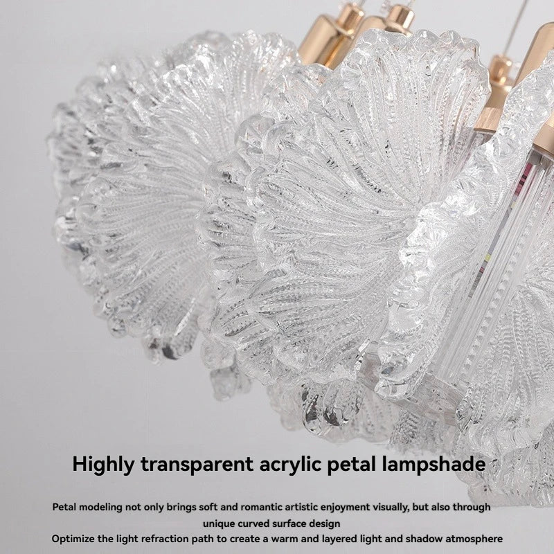 Highly transparent acrylic petal lampshade with gold accents on a gray background