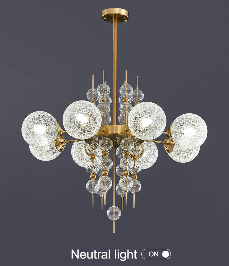 Chandelier with glass globe lights on a dark background