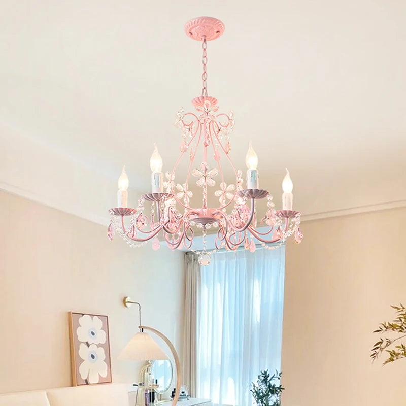 A softly lit pink bedroom featuring a pink crystal flower semi-flush mount chandelier.