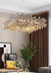 Luxurious chandelier hanging in a living room with decor elements.