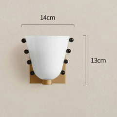 Wall sconce with measurements on a beige background