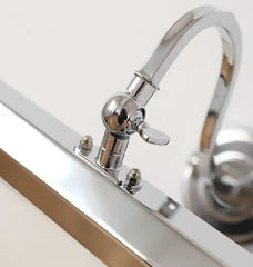 Chrome kitchen faucet on a white background