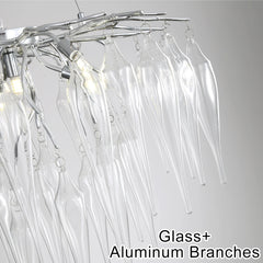 Chandelier with glass and aluminum branches on a gray background