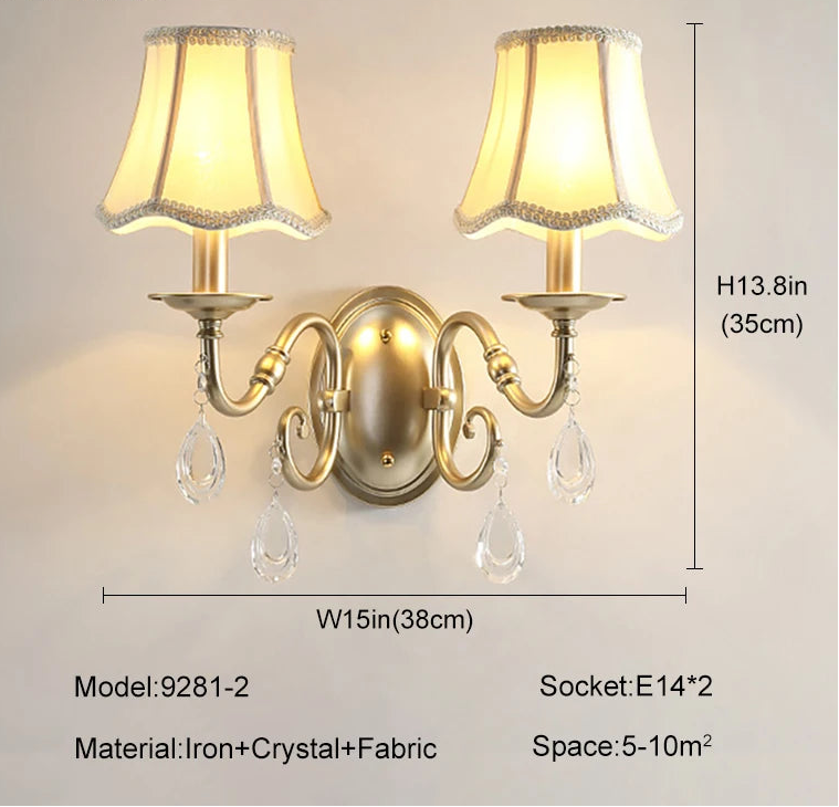 Wall lamp with decorative design, fabric shade, and crystal accents, featuring dimensions and specifications.