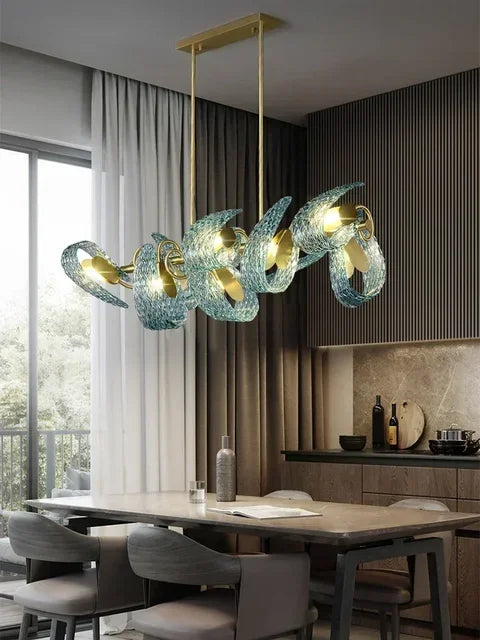 Modern chandelier with glass shades in a dining room setting