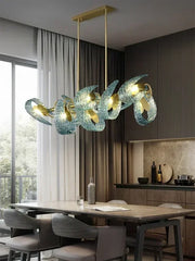 Modern chandelier with glass shades in a dining room setting