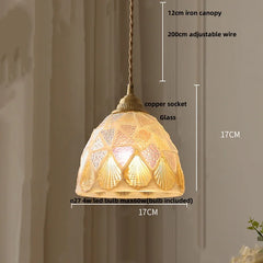 Decorative pendant light with measurements on a neutral background