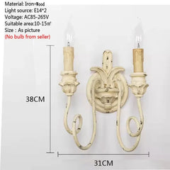 Decorative wall sconce with dimensions on a white background