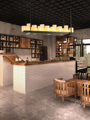 Modern interior design with a bar area, chairs, and decorative elements.