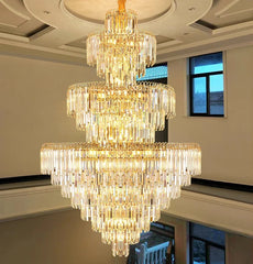 Luxurious chandelier hanging in a room with a window in the background