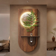 Close-up view of the modern wood grain wall light, highlighting the texture and the integrated LED illumination surrounding a green plant.