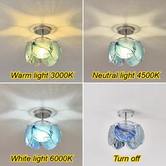 Four different colored floral glass pendant lights: blue, pink, green, and white, shown in a grid.