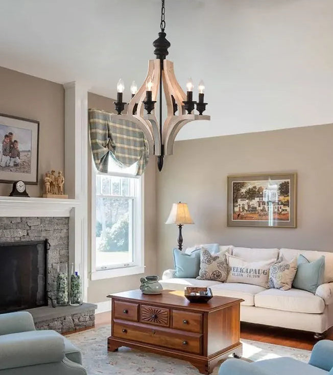 Living room with a fireplace, sofa, and decorative items.