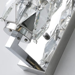 Close-up of a crystal chandelier with clear and silver details on a white background