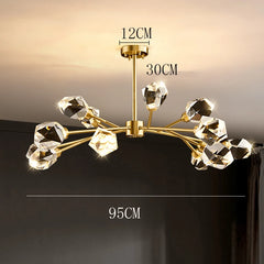 Gold chandelier with crystal-like fixtures on a dark background, showing measurements.