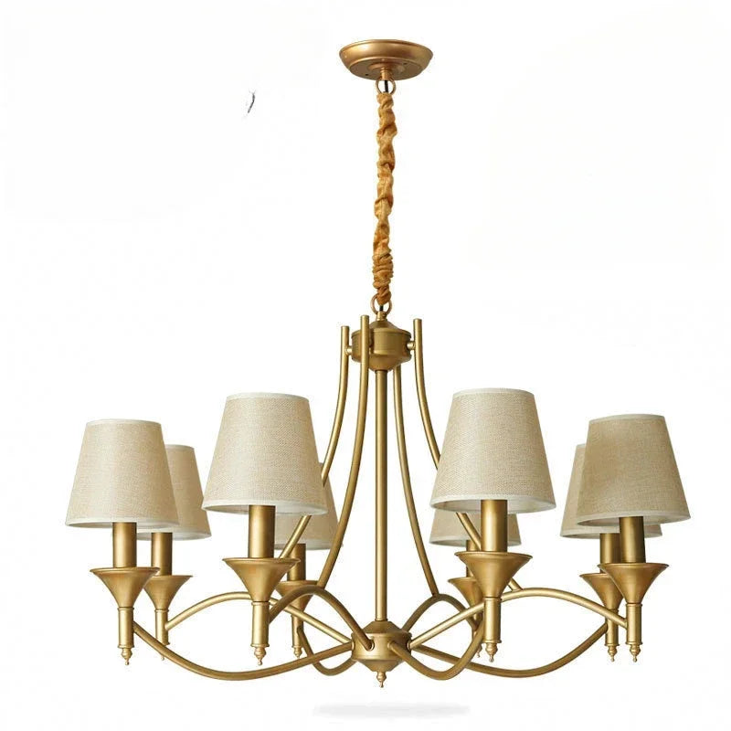Gold chandelier with beige lampshades on a white background